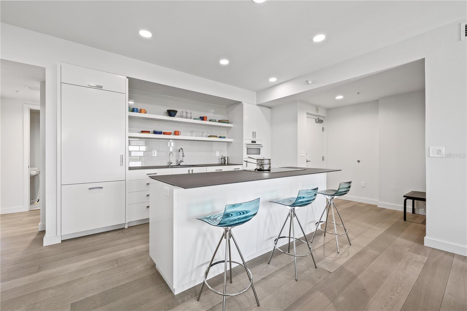 The island features an induction cooktop.