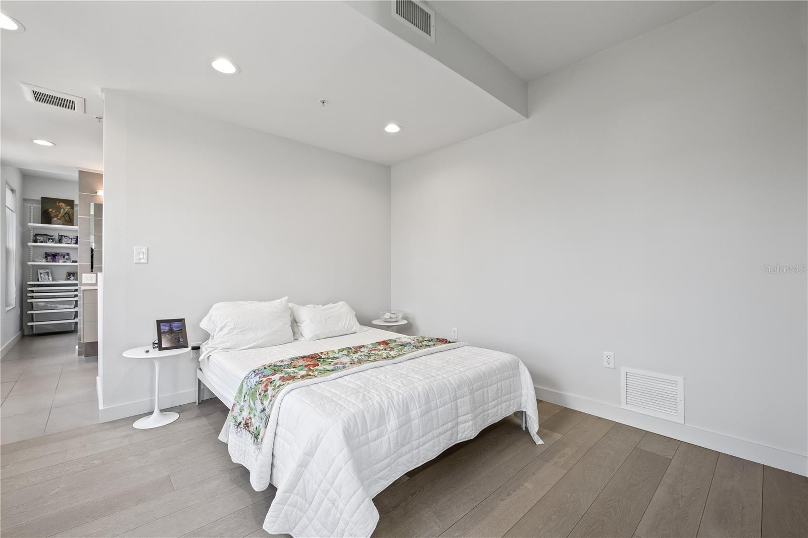 Spacious primary bedroom with a large en-suite bathroom and closet.