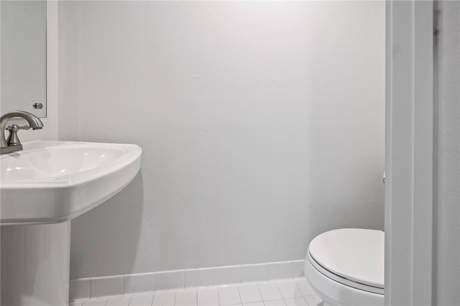 Half bathroom next to the laundry room.