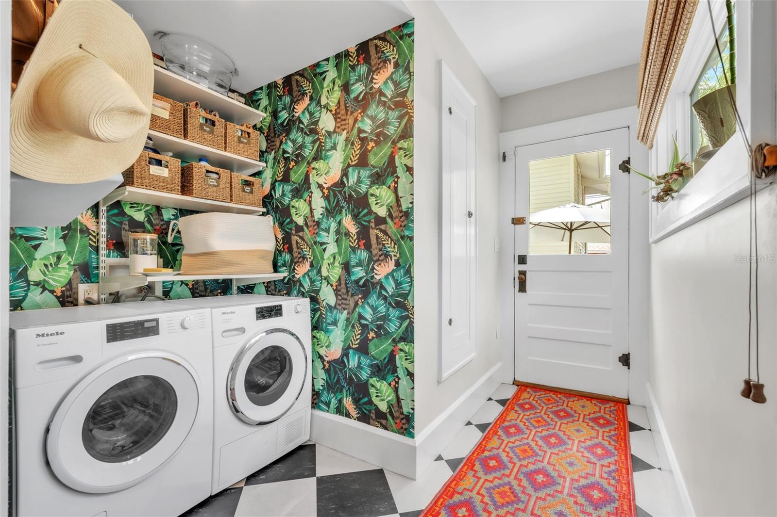 Laundry off kitchen and door to backyard