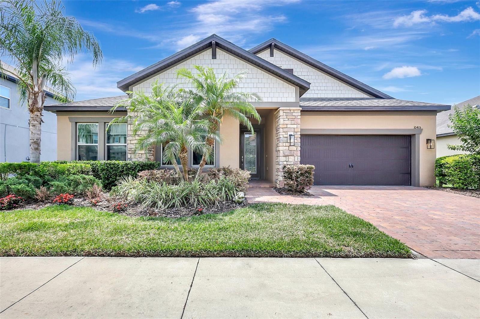 Florida Style Home featuring neighborhood sidewalks-