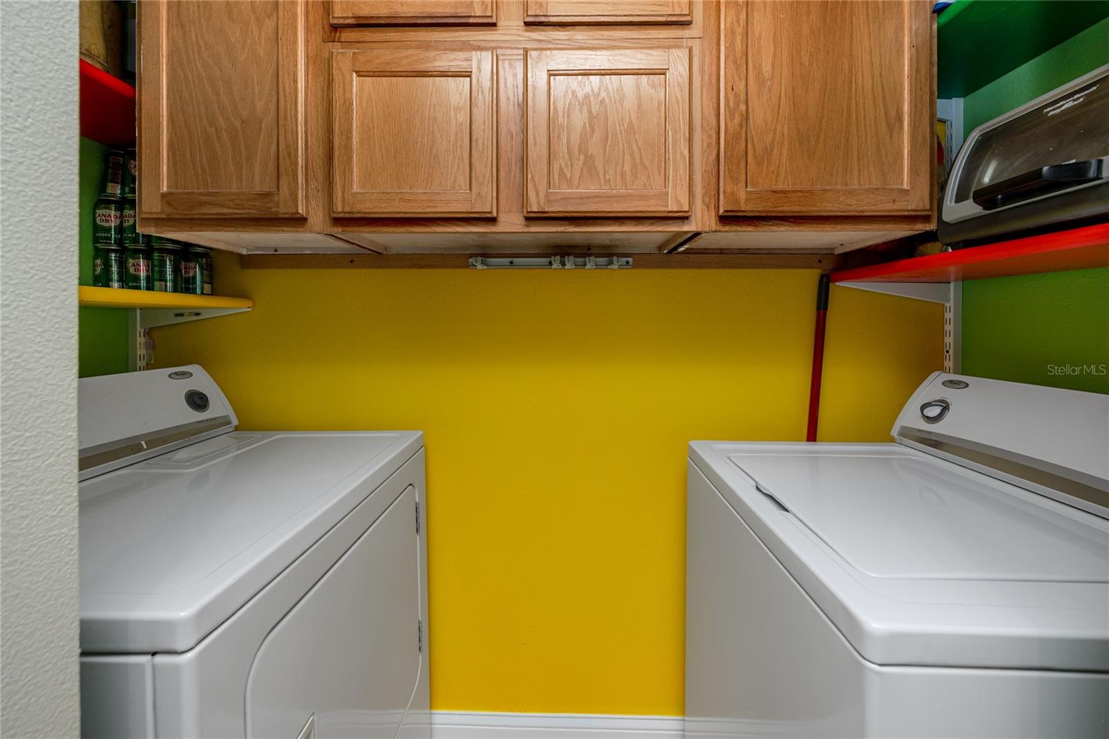 In unit laundry with additional storage cabinets