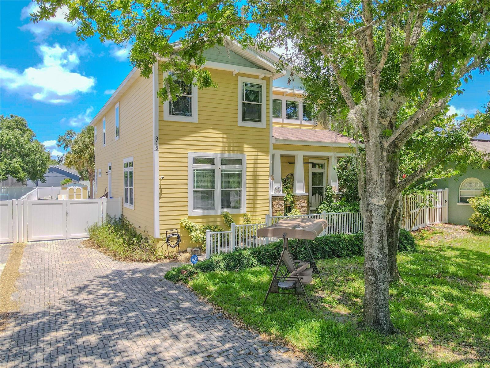 4-bedroom, 4-bath home with a versatile loft, located in the heart of charming Oldsmar!This cheerful two-story home radiates curb appeal with its welcoming covered front porch framed by  columns and classic white railing. Mature trees provide shade and a picturesque setting, while the brick paver driveway and white vinyl fencing add both style and privacy. Large, private backyard,