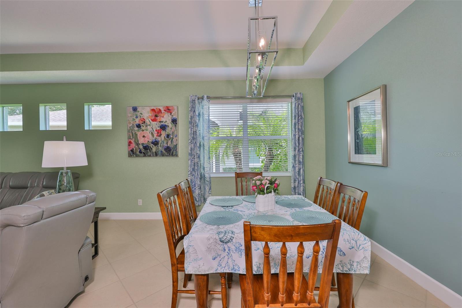 Custom lighting and large windows make this a bright and happy space.