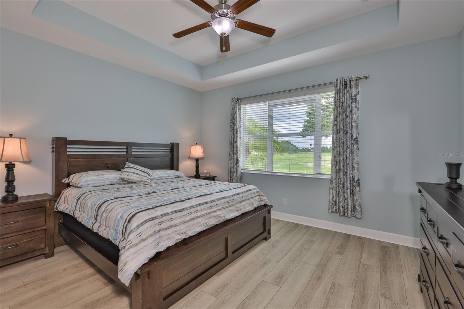 Lots of natural Florida sunshine flows into the bedroom.  The view, a trey ceiling, custom fan and beautiful furniture truly makes this room feel like you are at a resort!