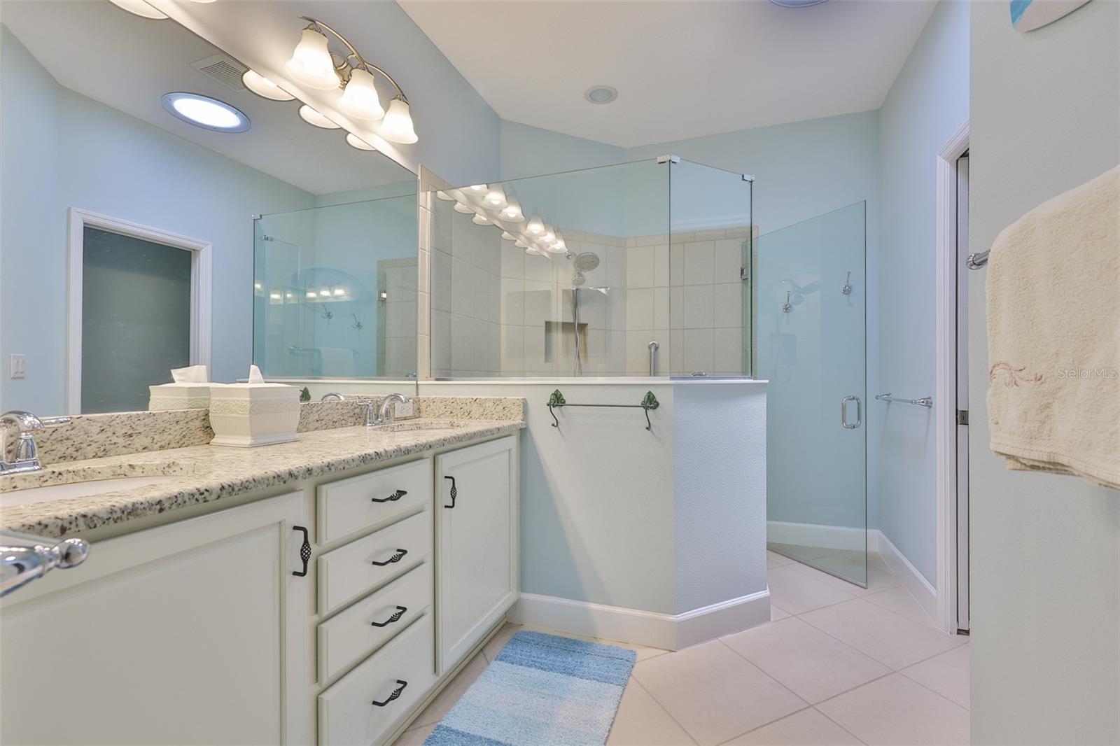 Ensuite Bathroom has been beautifully updated to match the kitchen and the rest of the home.  Granite counters, all wood cabinetry and modern shower.  The water closet is separate with a sliding door for complete privacy.