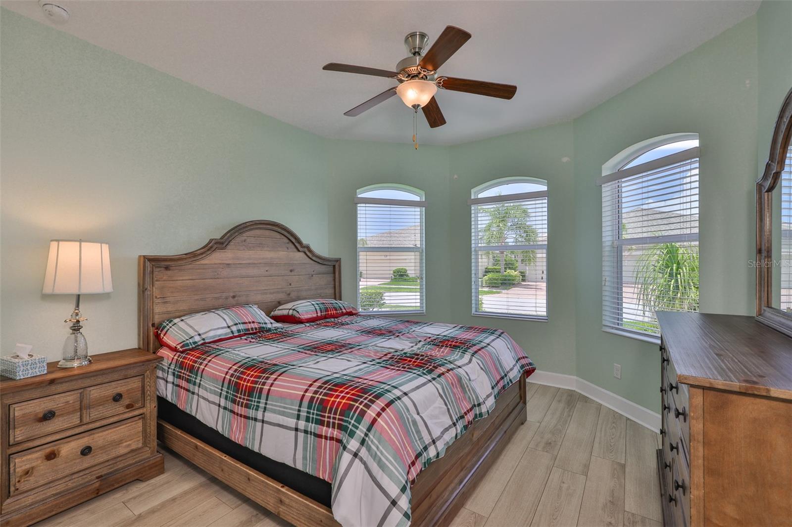Bedroom #2 has the lovely bay windows for sunshine.  Notice the lovely plank flooring and soft neutral paint tones. Remember ALL furniture conveys with the sale, if desired.