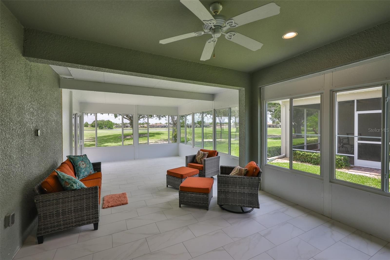 And THIS is what makes this villa so EXCEPTIONAL!!  BRAND NEW 27 X 24 FLORIDA ROOM and OUTSIDE CUSTOM PAVERED open air patio with grill.  WHAT A VIEW!!