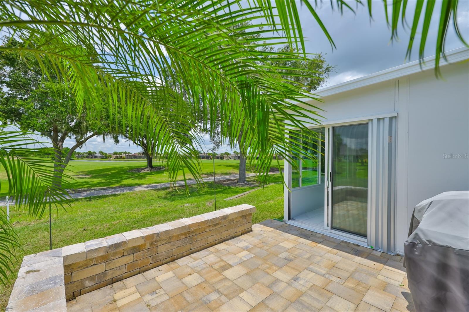 The outdoor grill stays, so set up some chairs so that you can enjoy the best that Florida living has to offer.