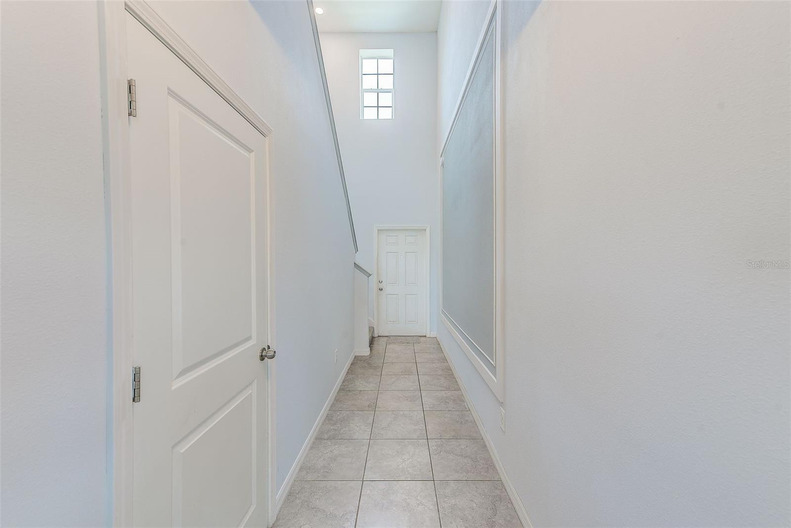 Entry hall facing front door.