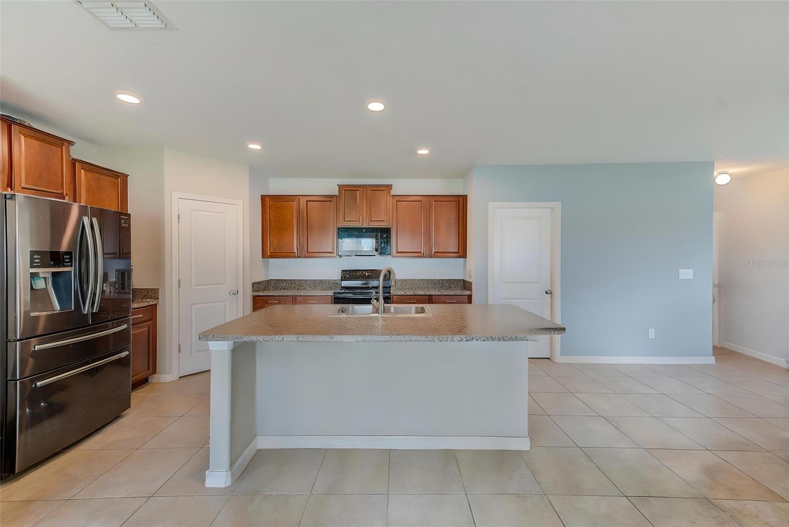 Kitchen has ample storage.