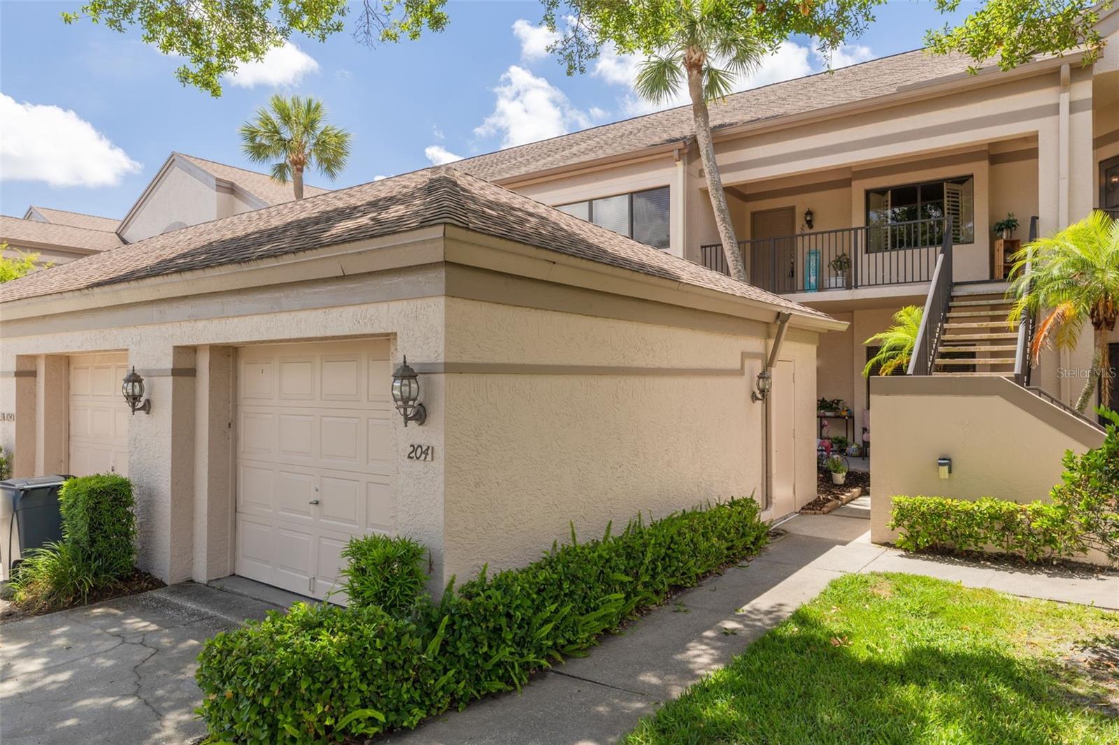 Side door of the one-car garage leads straight to the stairs for quick access to your condo!