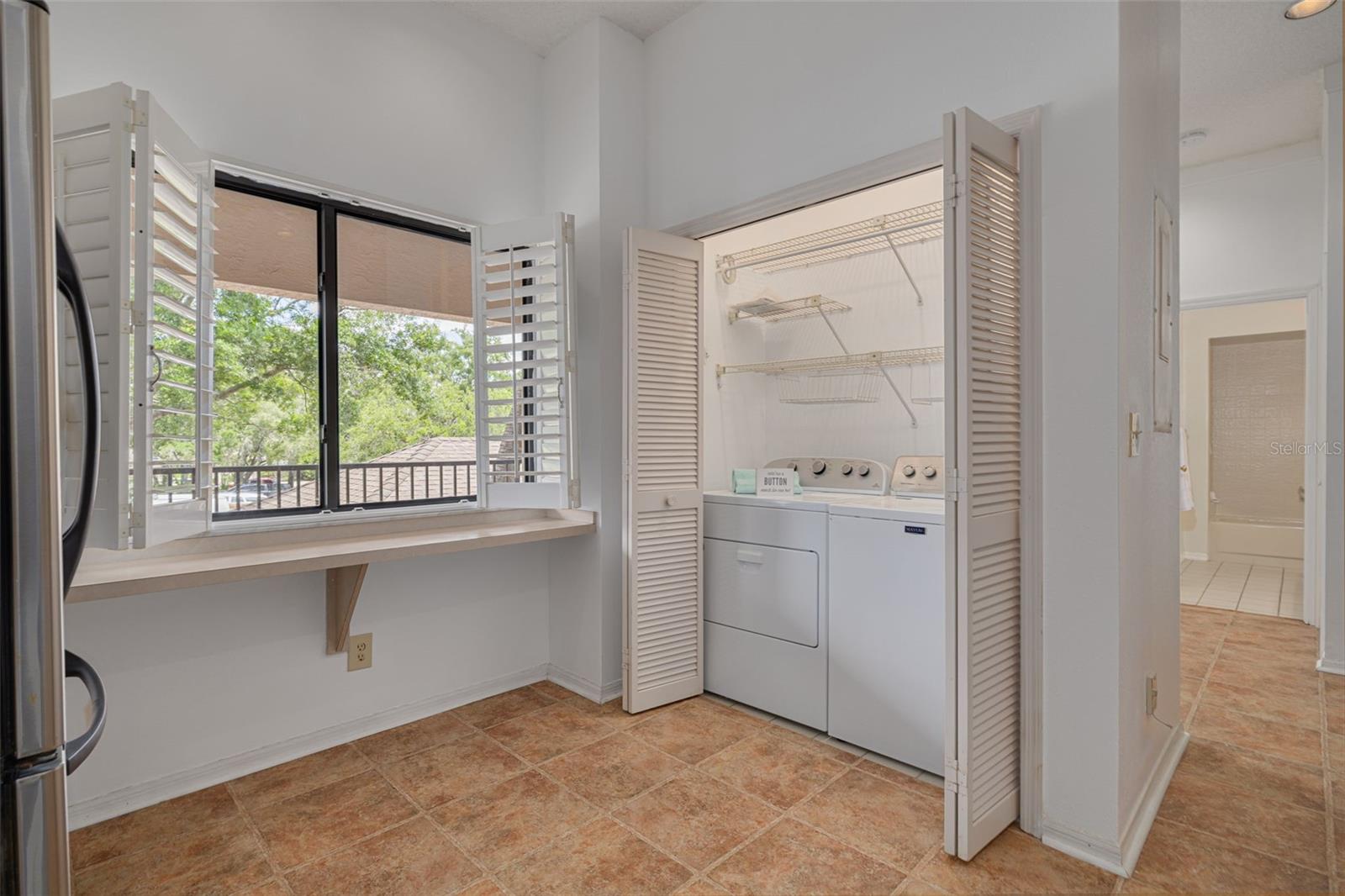 Washer and dryer are included and are conveniently located in the kitchen! Natural light comes through the wide windows!