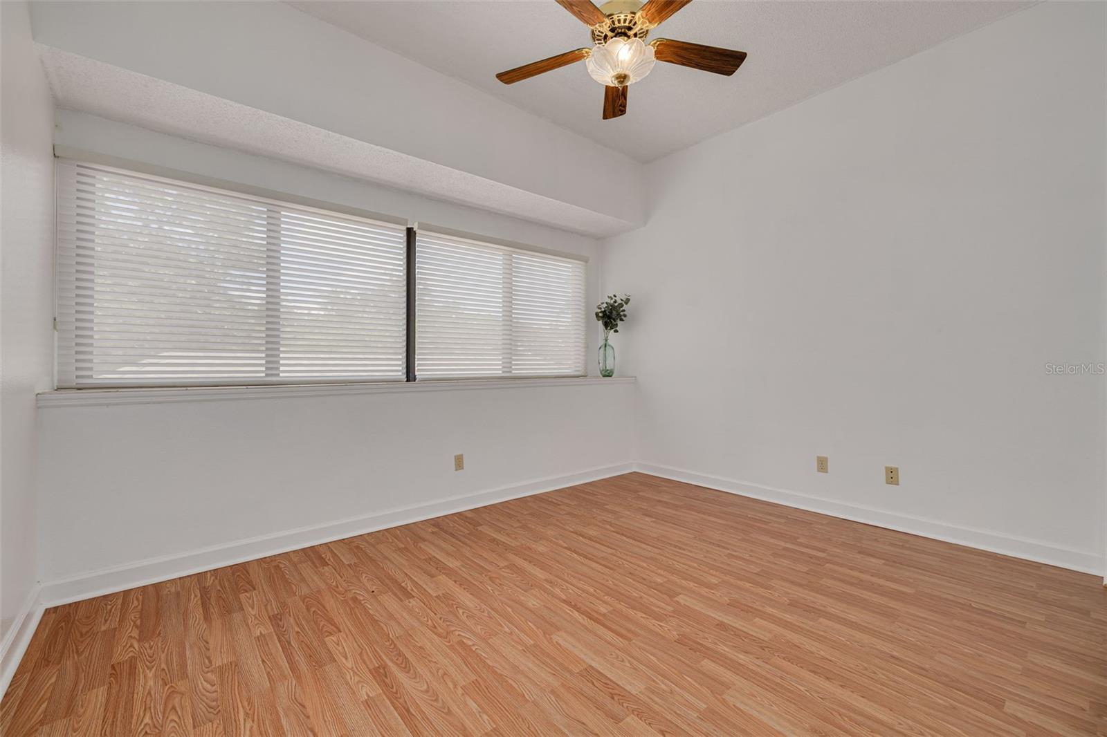 Front bedroom offers natural light through the wide windows