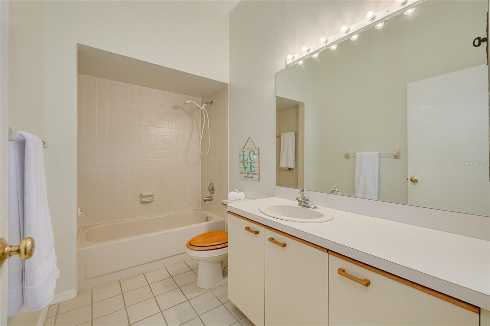 Hall bathroom offers a tub and shower