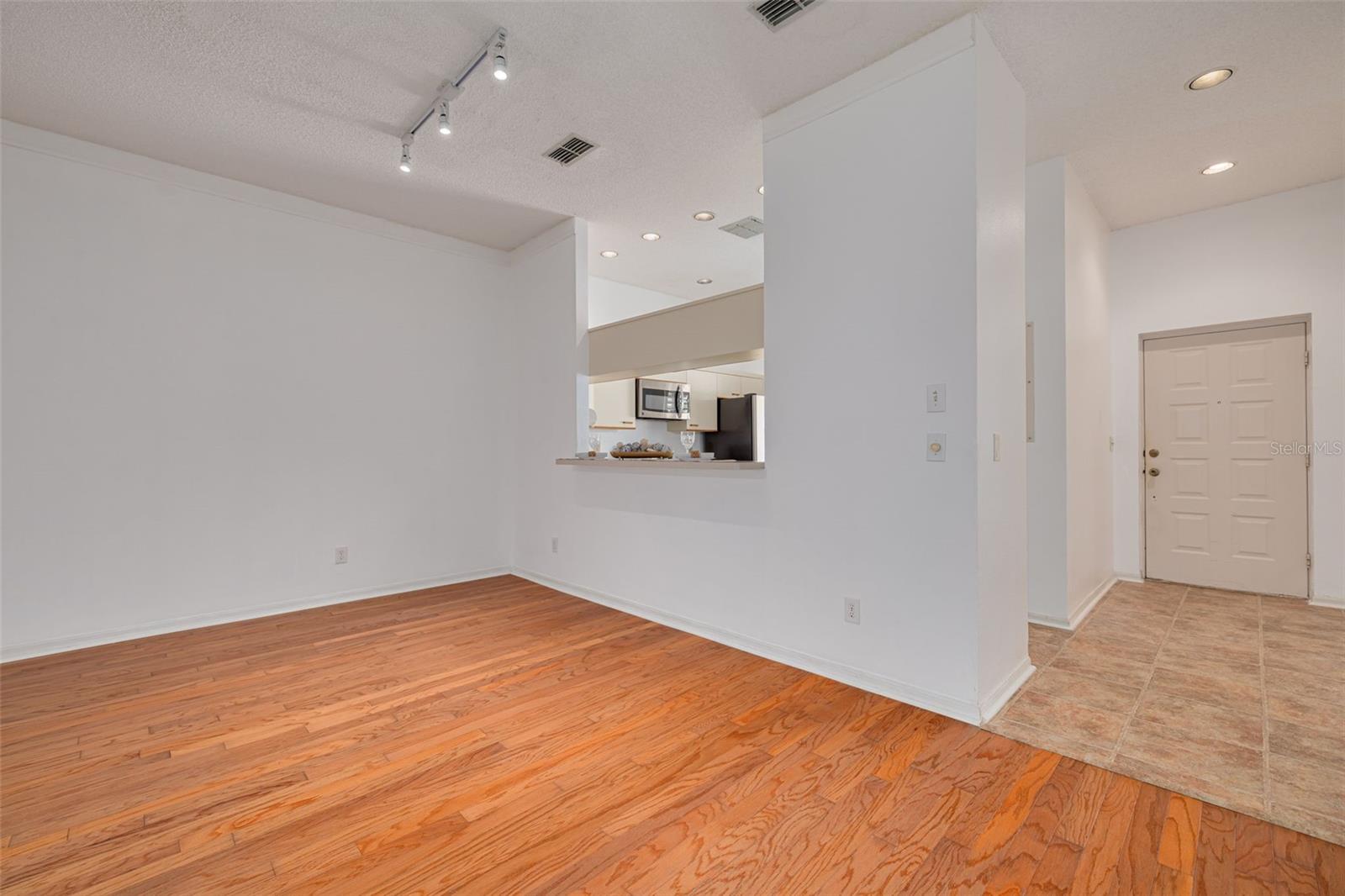 LR looking toward front door and breakfast bar