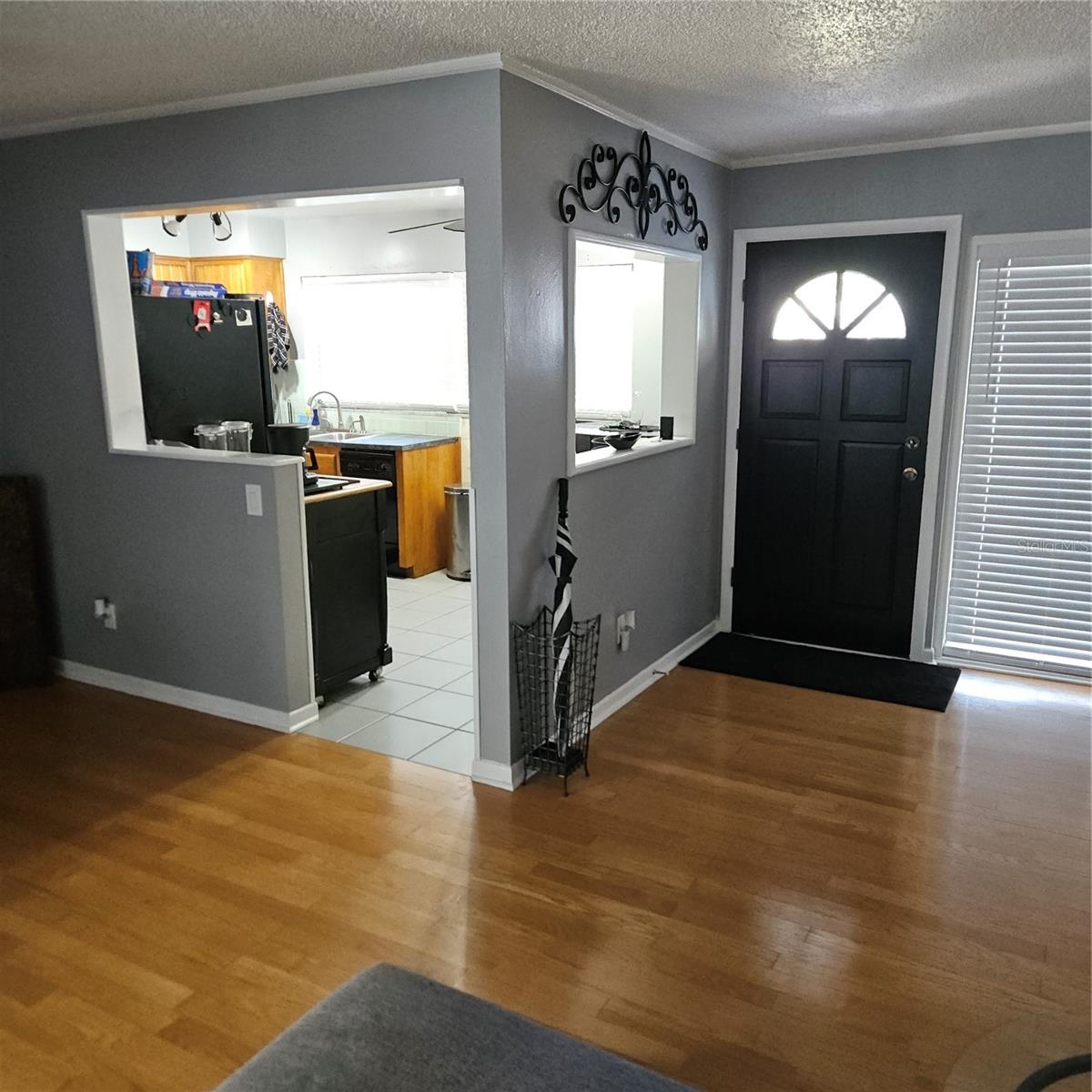 View of Entrance and Kitchen from the Dining room