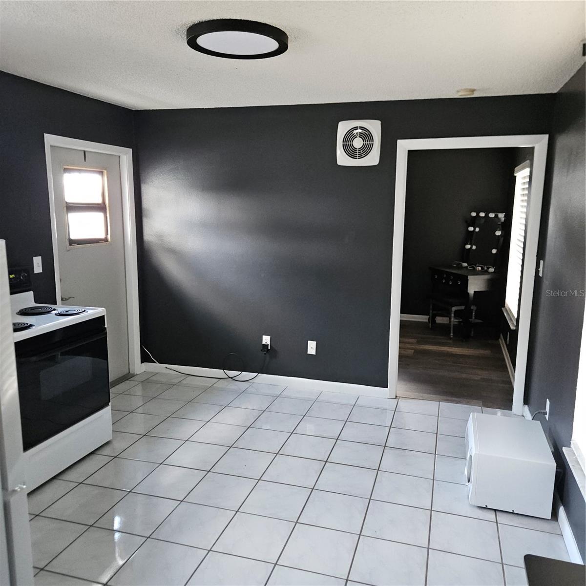 Apartment Kitchen with Door to Bedroom