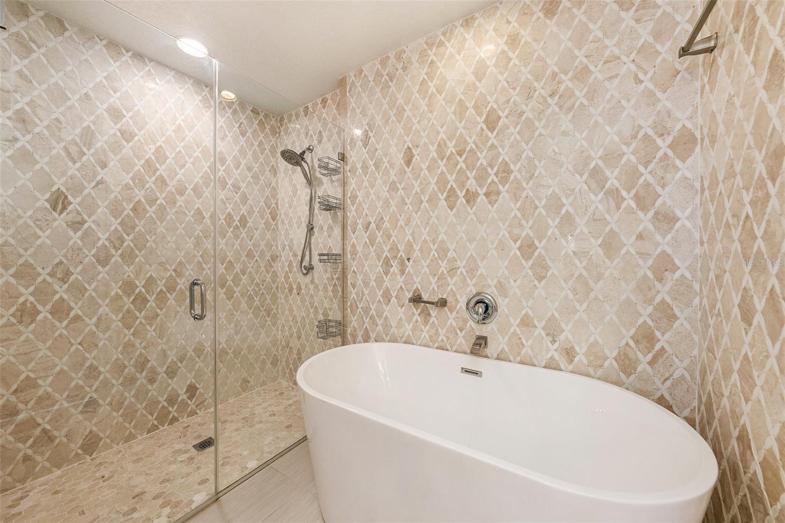 Owners Suite with updated tiles, tub and shower