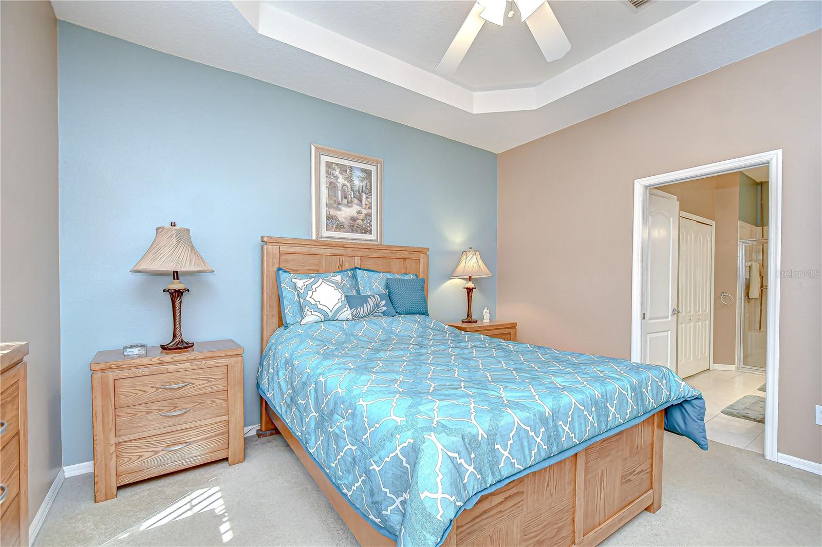 Primary bedroom features a tray ceiling!