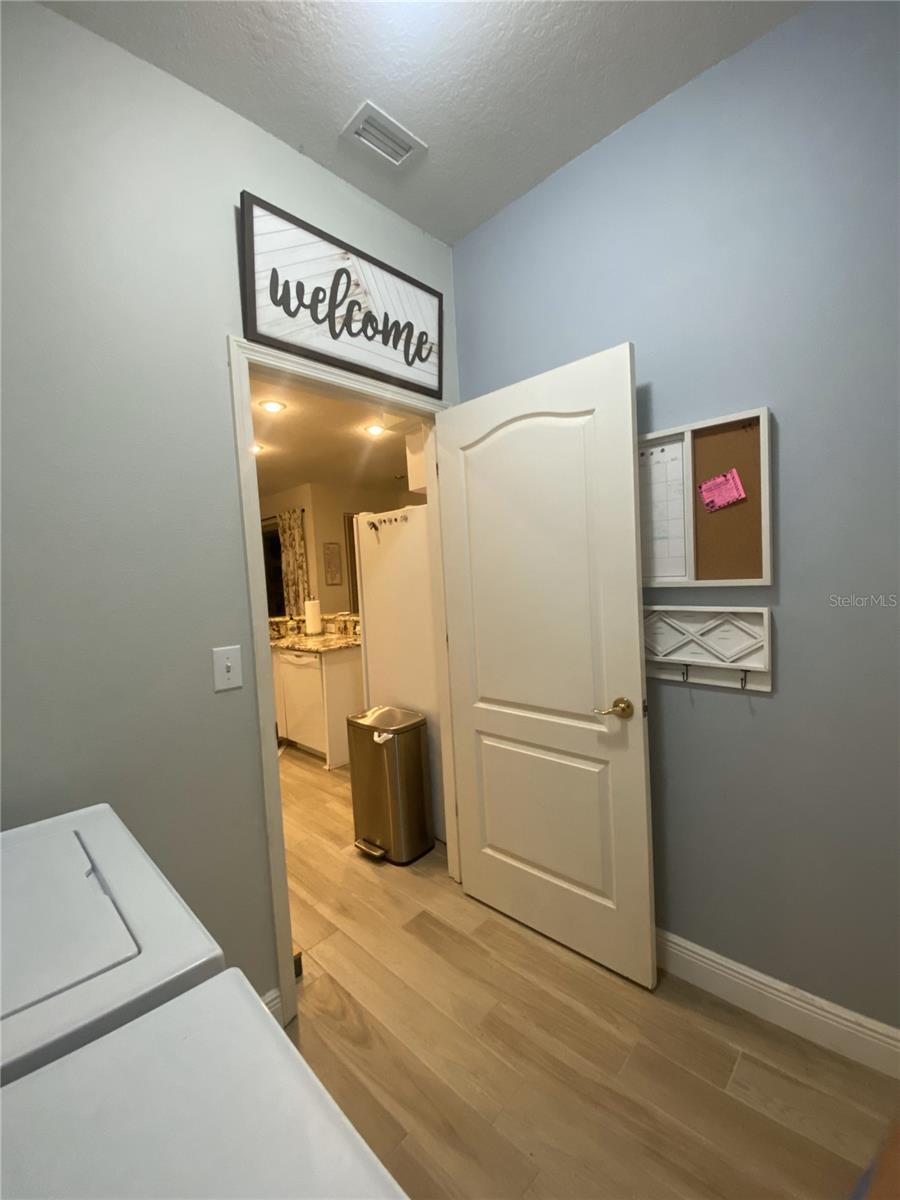 Interior Laundry Room opening into Kitchen