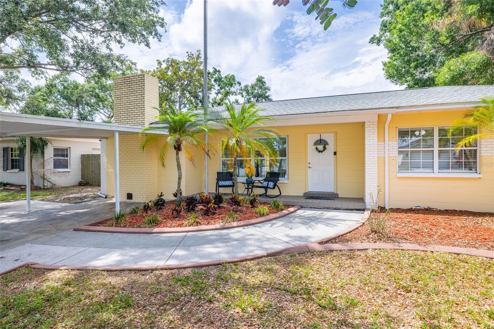 Enjoy relaxing on your front porch while taking in the charm of a tree-lined street, with newer homes built just across the way.