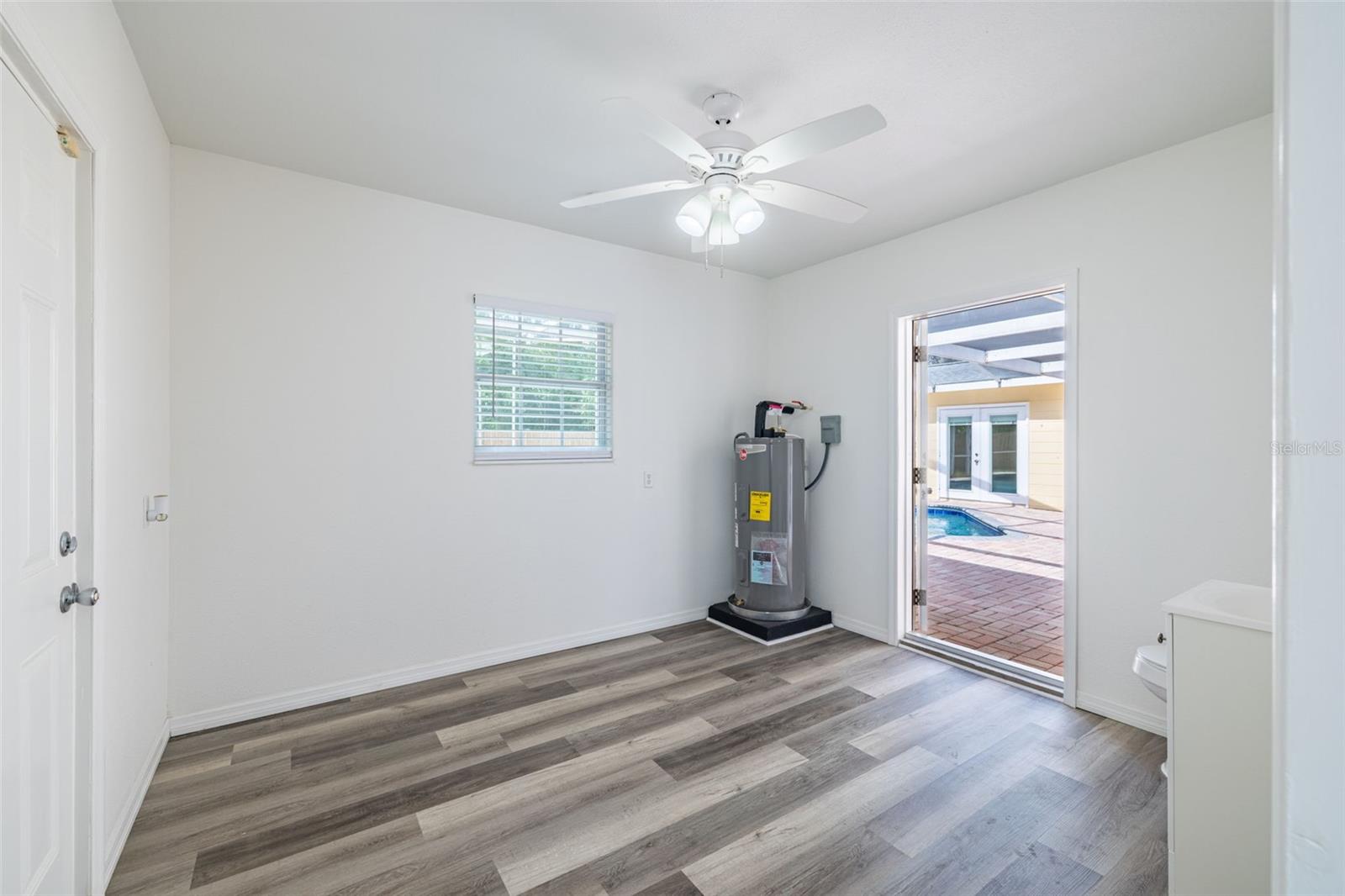 This room is currently and primarily used as a pool bathroom and storage. However, it presents an excellent opportunity for reconfiguration. Close it off from the main area, and you can create a small office or flex room directly off the living room, perfect for remote work or a quiet retreat.