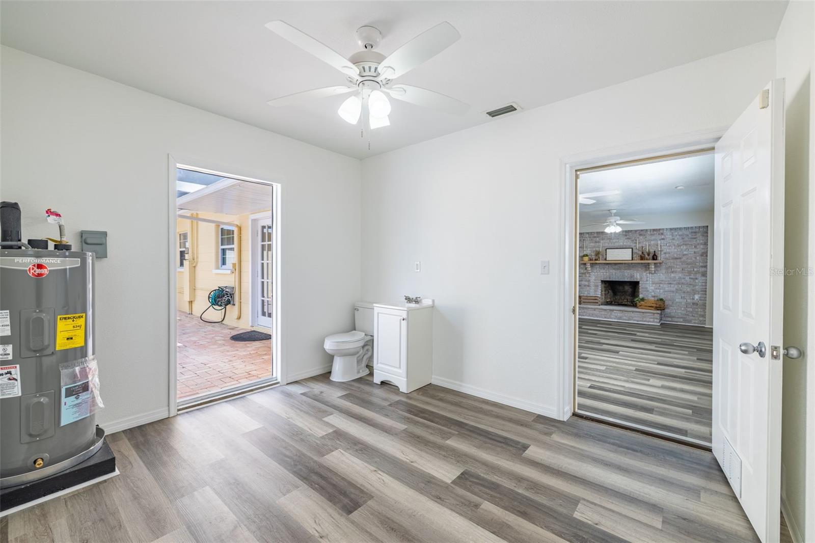 This space could easily be converted into a private on-suite area by closing it off from the kitchen with access to outside and your own private half bathroom.
