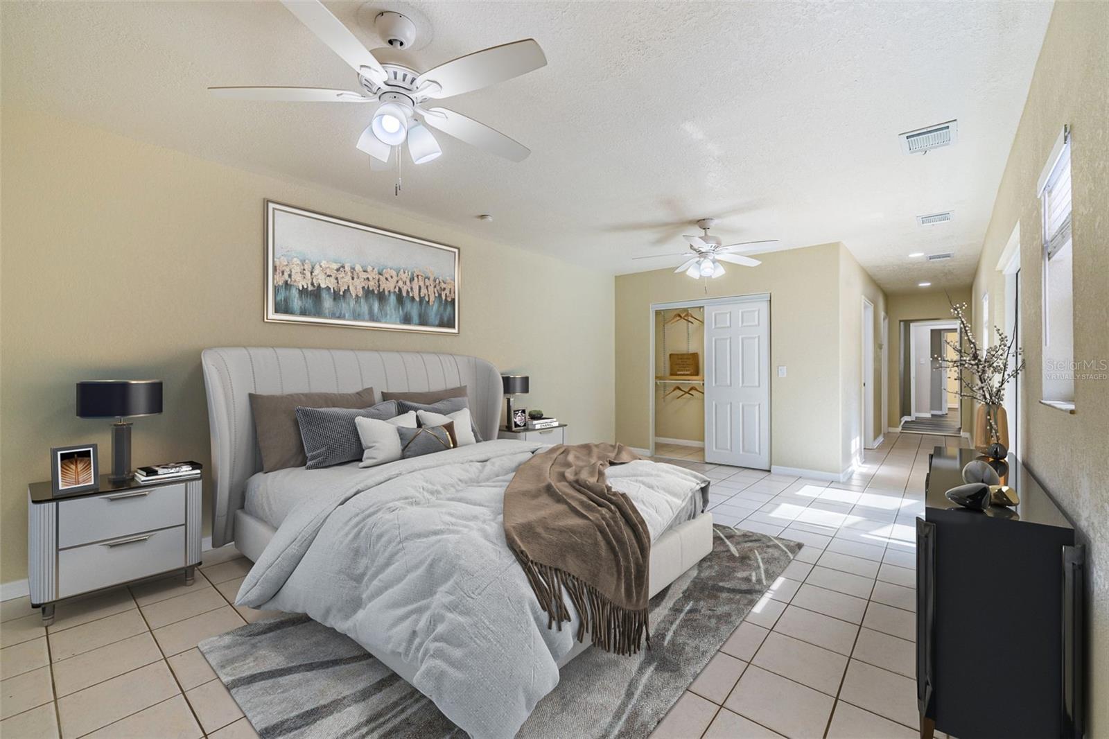 Spacious primary bedroom suite set apart from the rest of the home, offering privacy, comfort, and a quiet retreat. Room for a sitting area, home office, or personal sanctuary *virtually staged