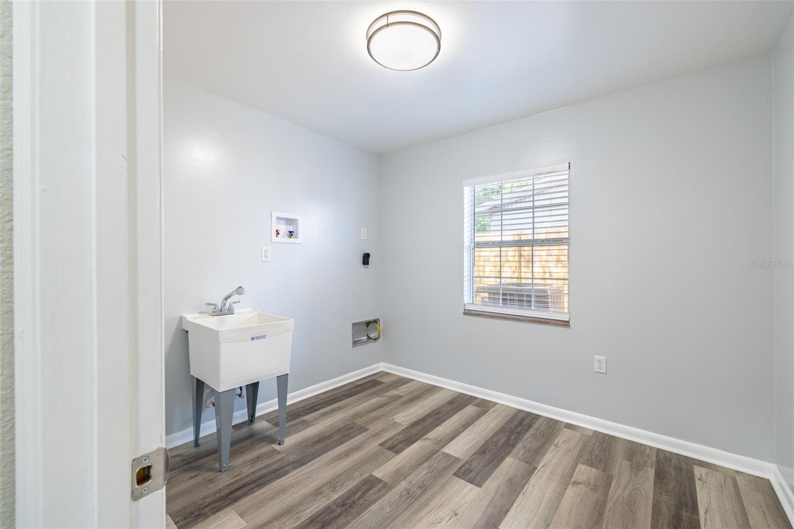 Enjoy a spacious laundry room complete with a convenient utility sink — perfect for tackling everyday chores with ease.