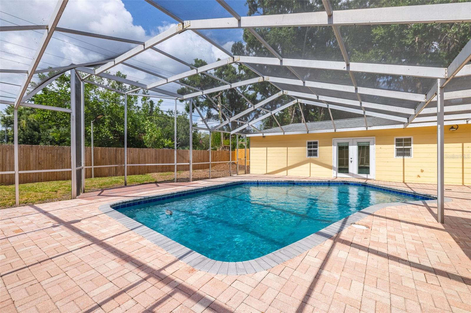 Huge pool area with plenty of space for sunbathing and outdoor relaxation.