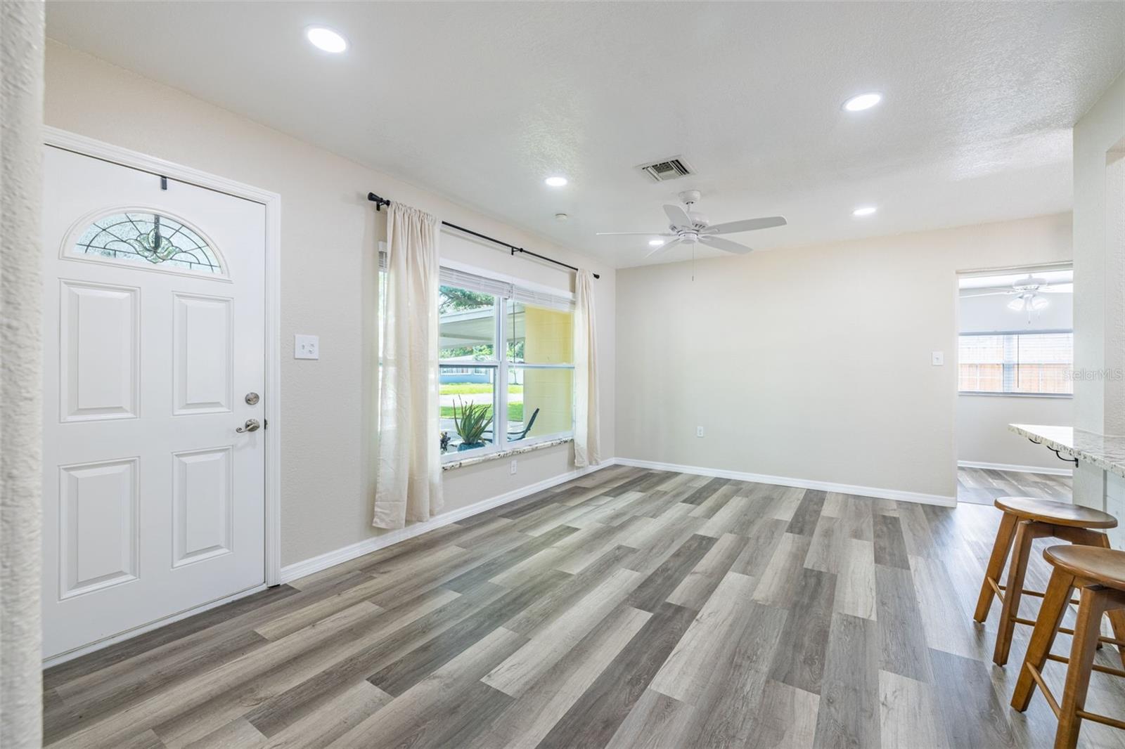 The dining room and kitchen flow seamlessly together, but the layout also offers flexibility — this area could easily function as a cozy living room or sitting area.