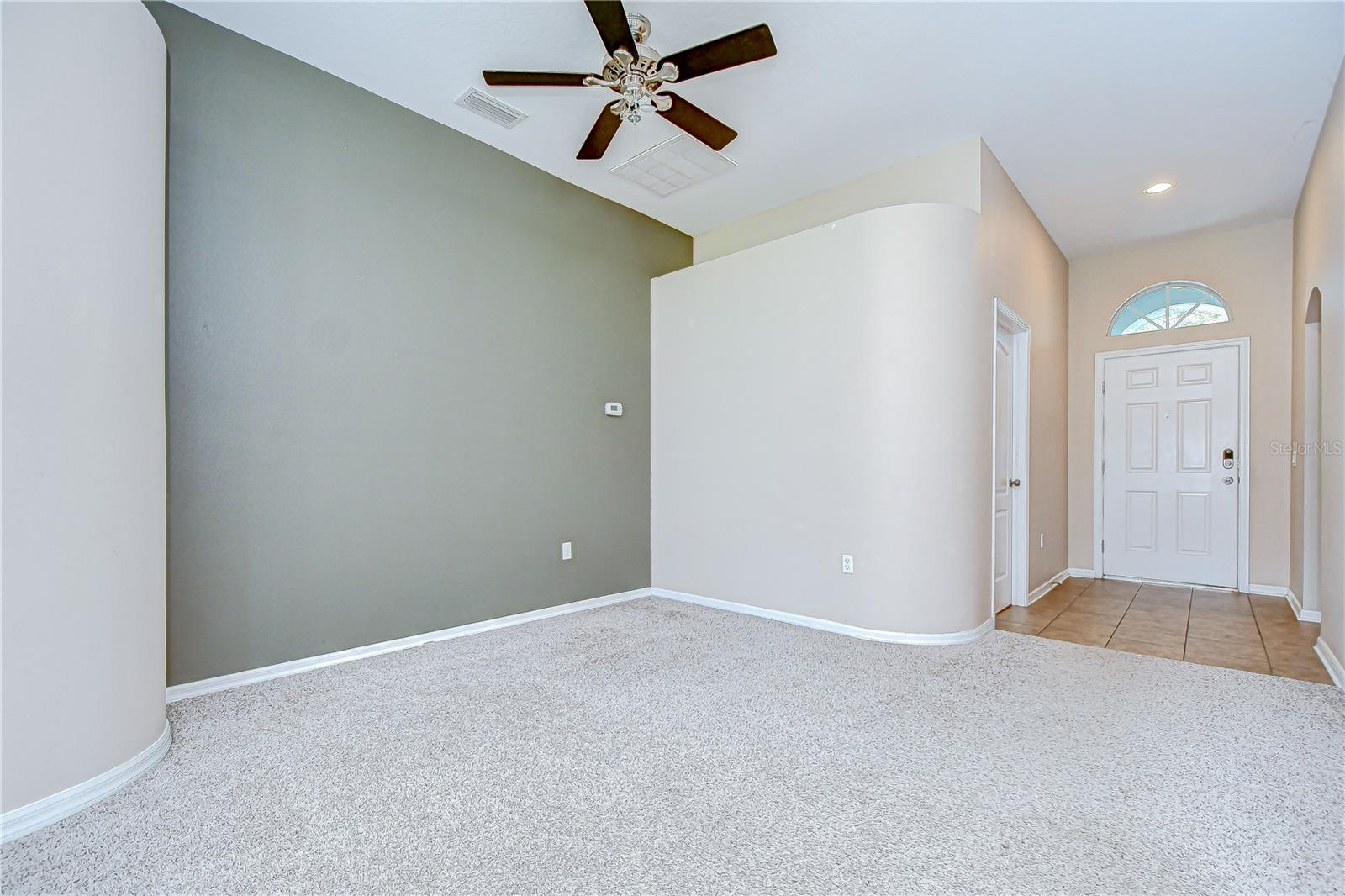 Inside, the home boasts a light-filled open floor plan with spacious living and dining areas!