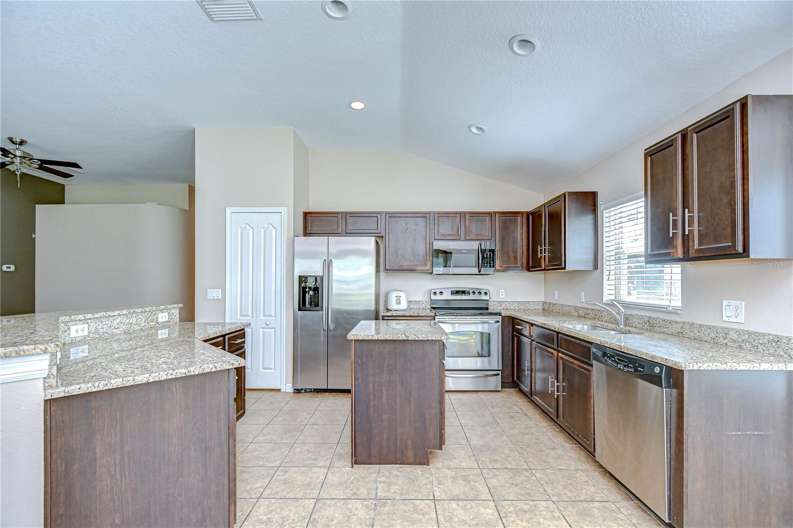 Kitchen boasts granite countertops, stainless steel appliances, and a center island!