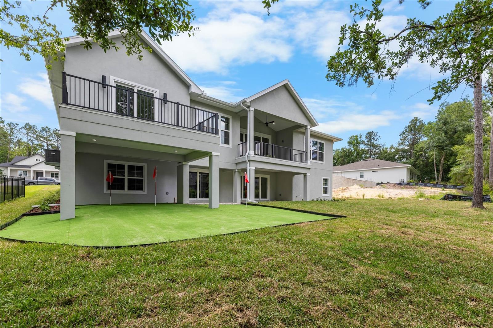 putting green, 2 separate balconies plus covered entertaining area in the back yar