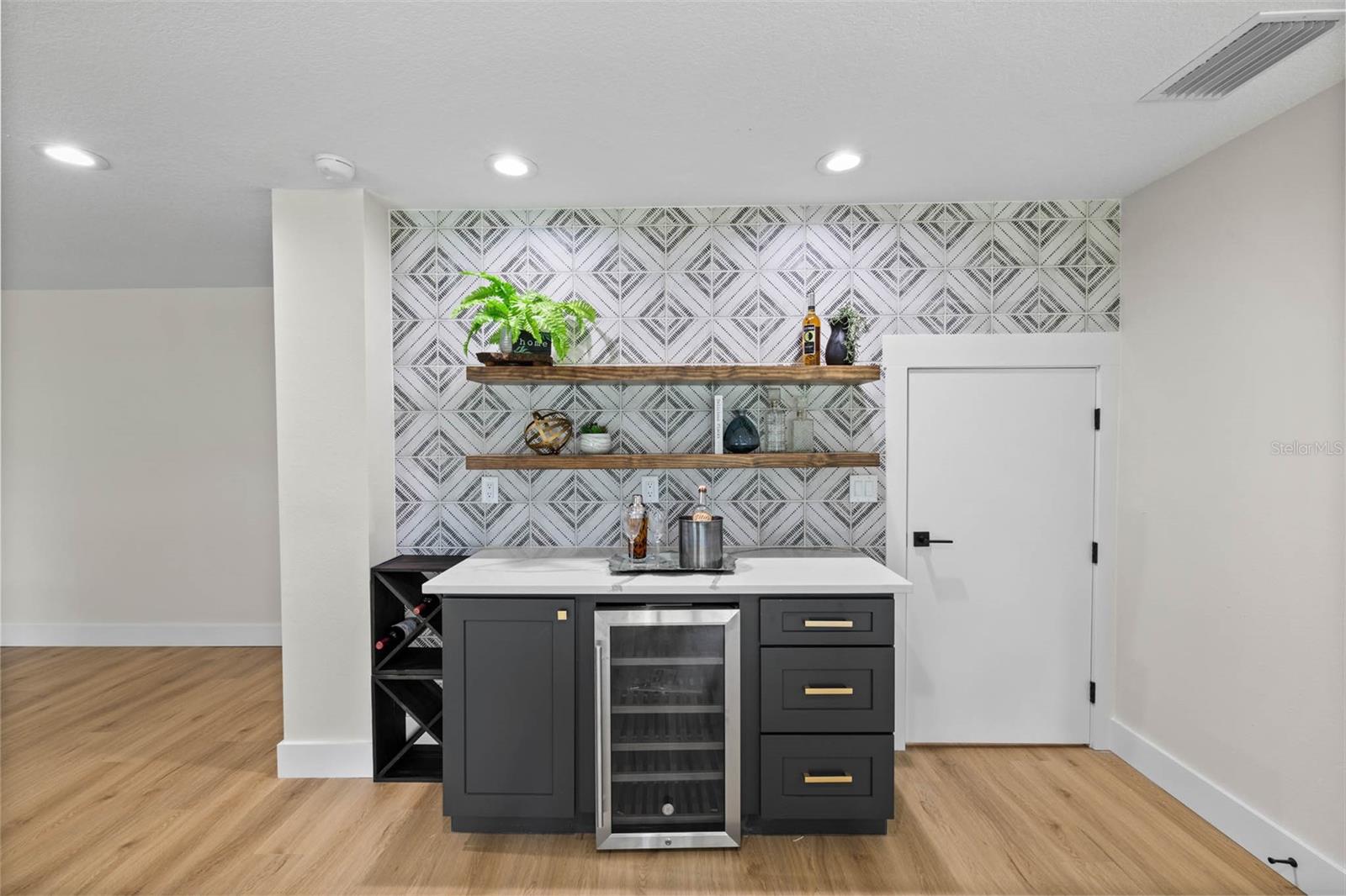 Lower level bonus room - dry bar with built in wine refrigerator