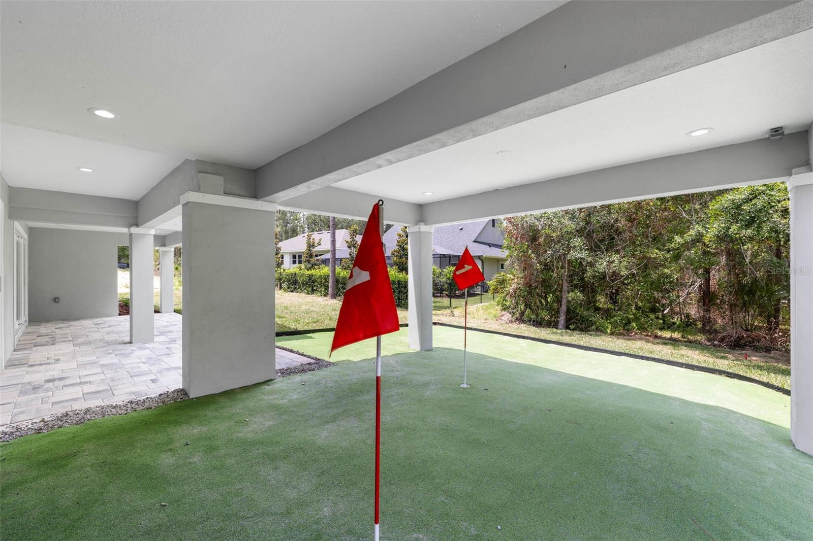 putting green with covered entertainment area