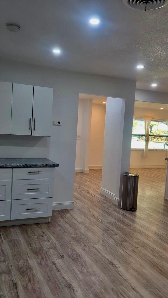 part of kitchen looking into living room