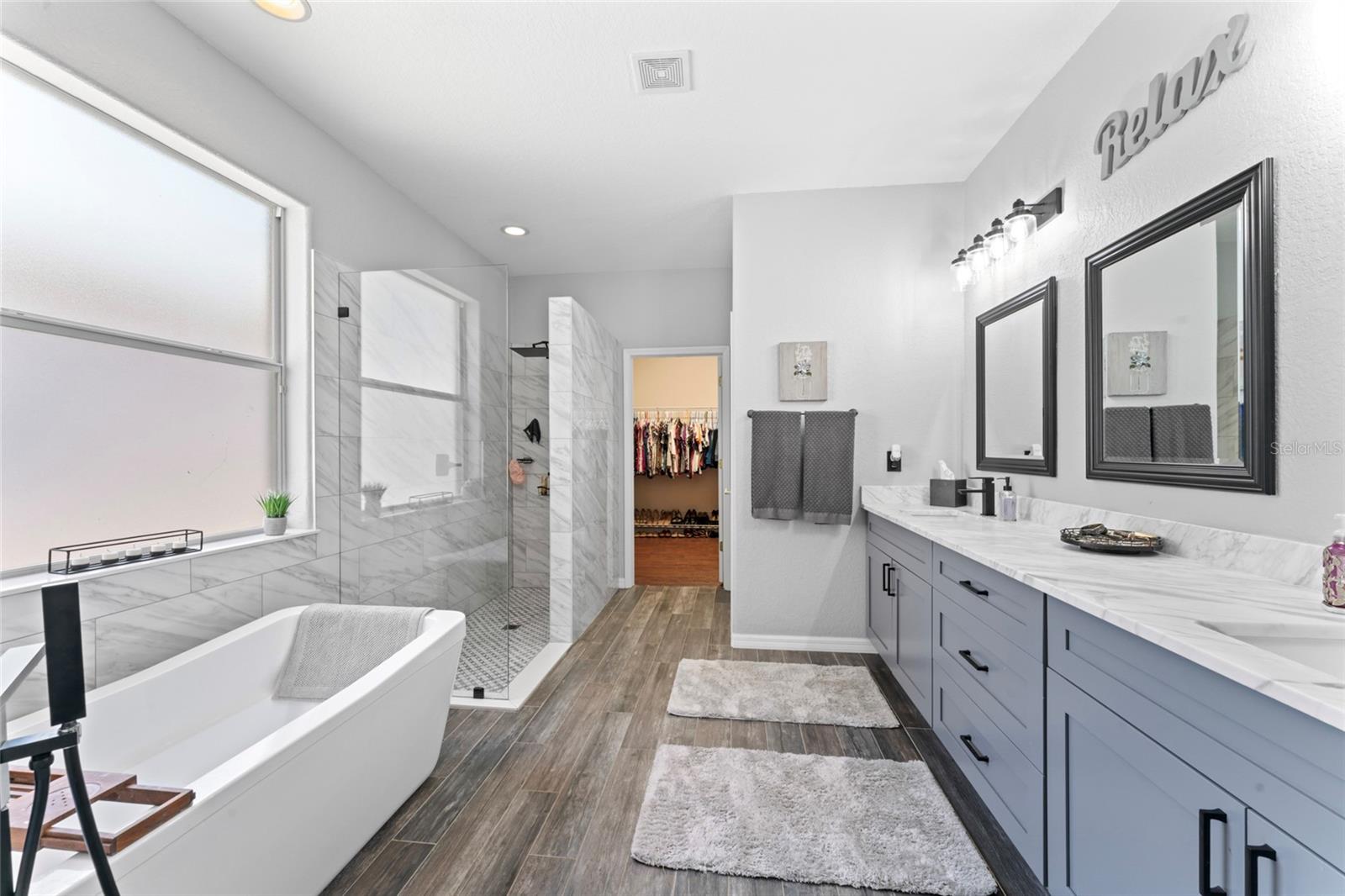 remodeled primary suite bathroom brings the wow factor