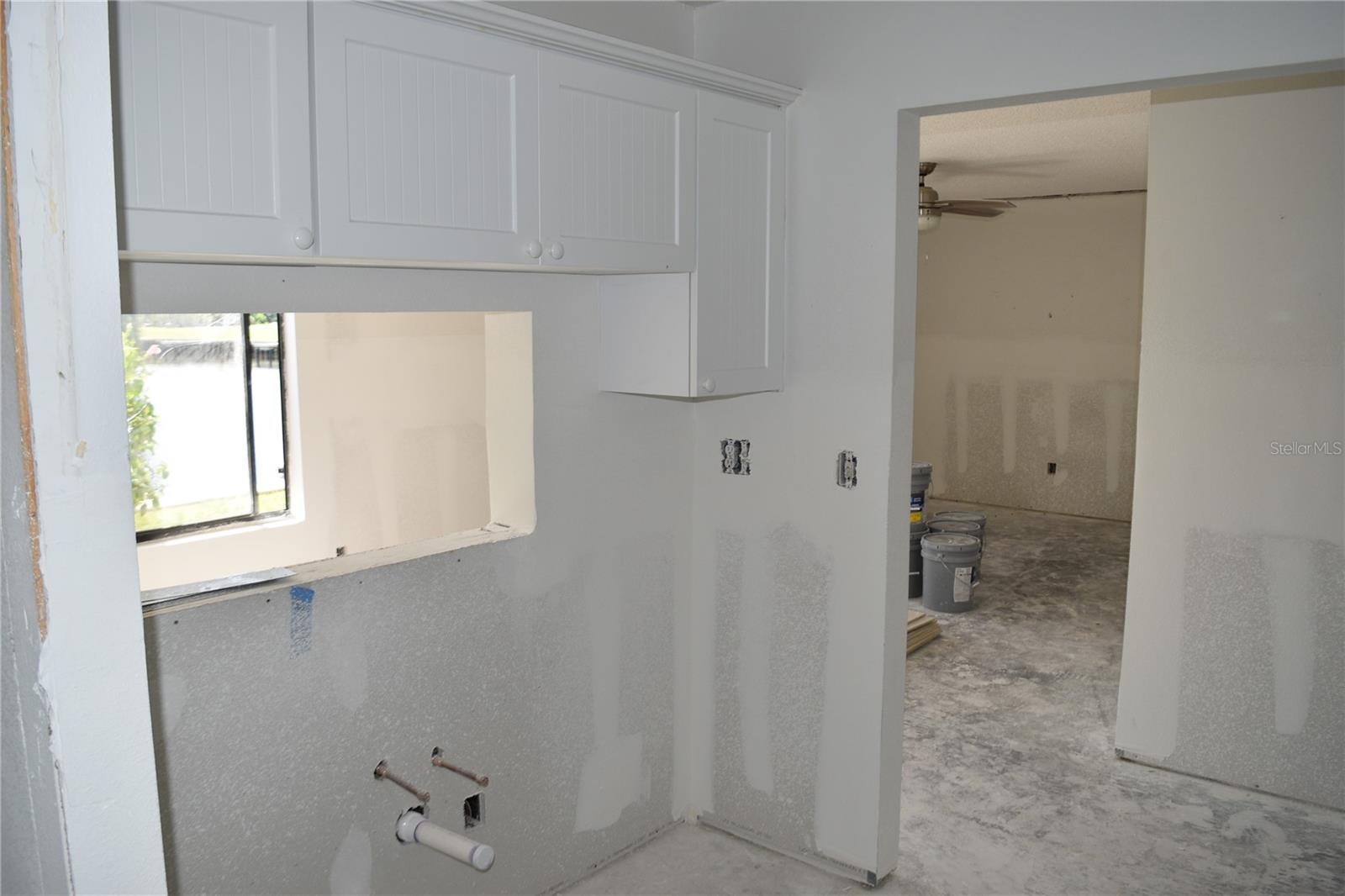 Kichen facing living room through doorway