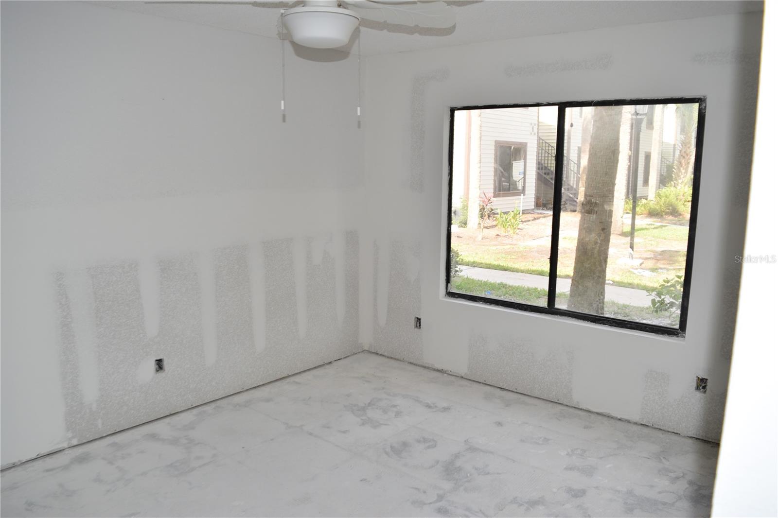 Primary bedroom window view looks West