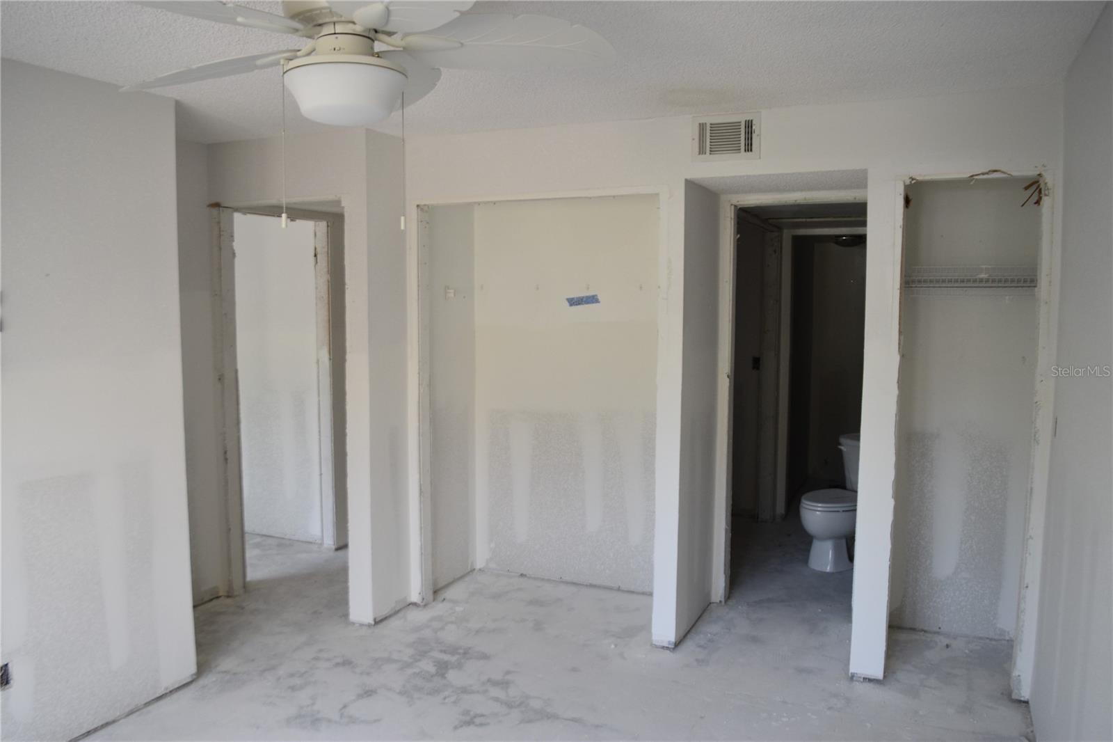 Primary bedroom en-suite bathroom doorway and second closet