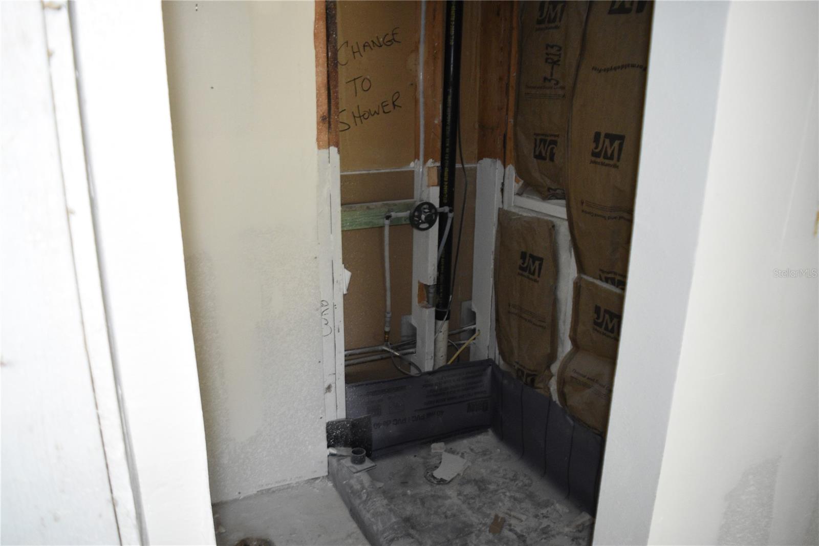 Primary en-suite bathroom comode and shower area