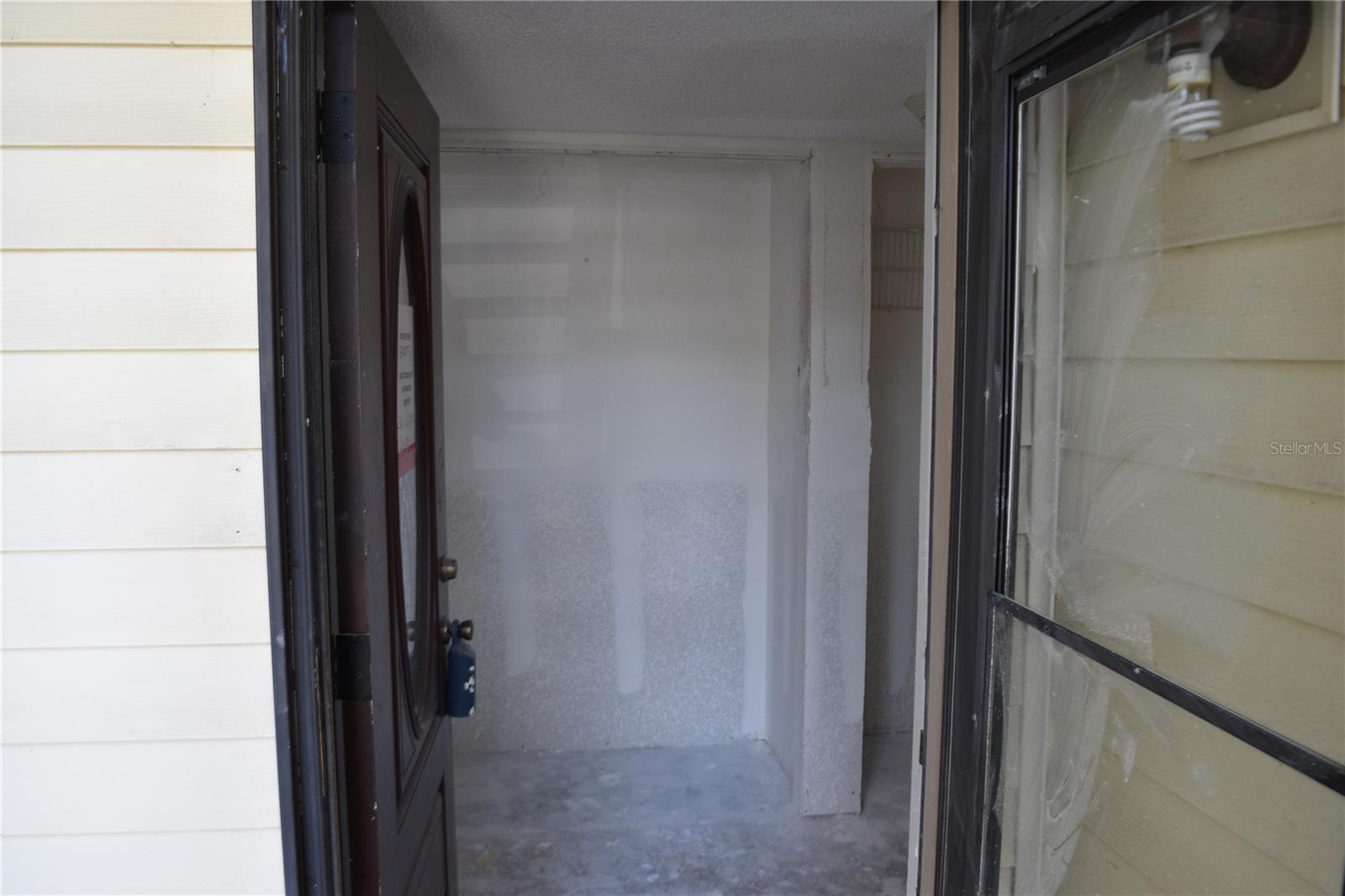 Entrance door to hallway closets