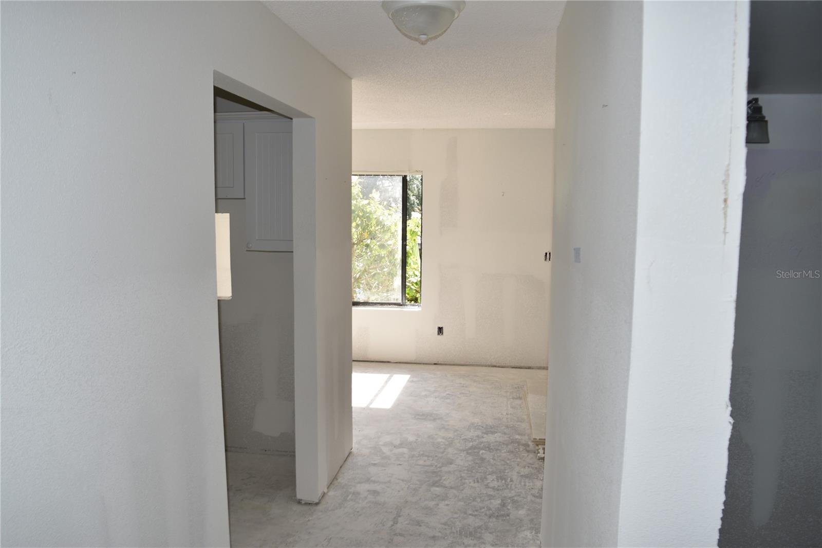 Hall to kitchen, dining, living rooms.
