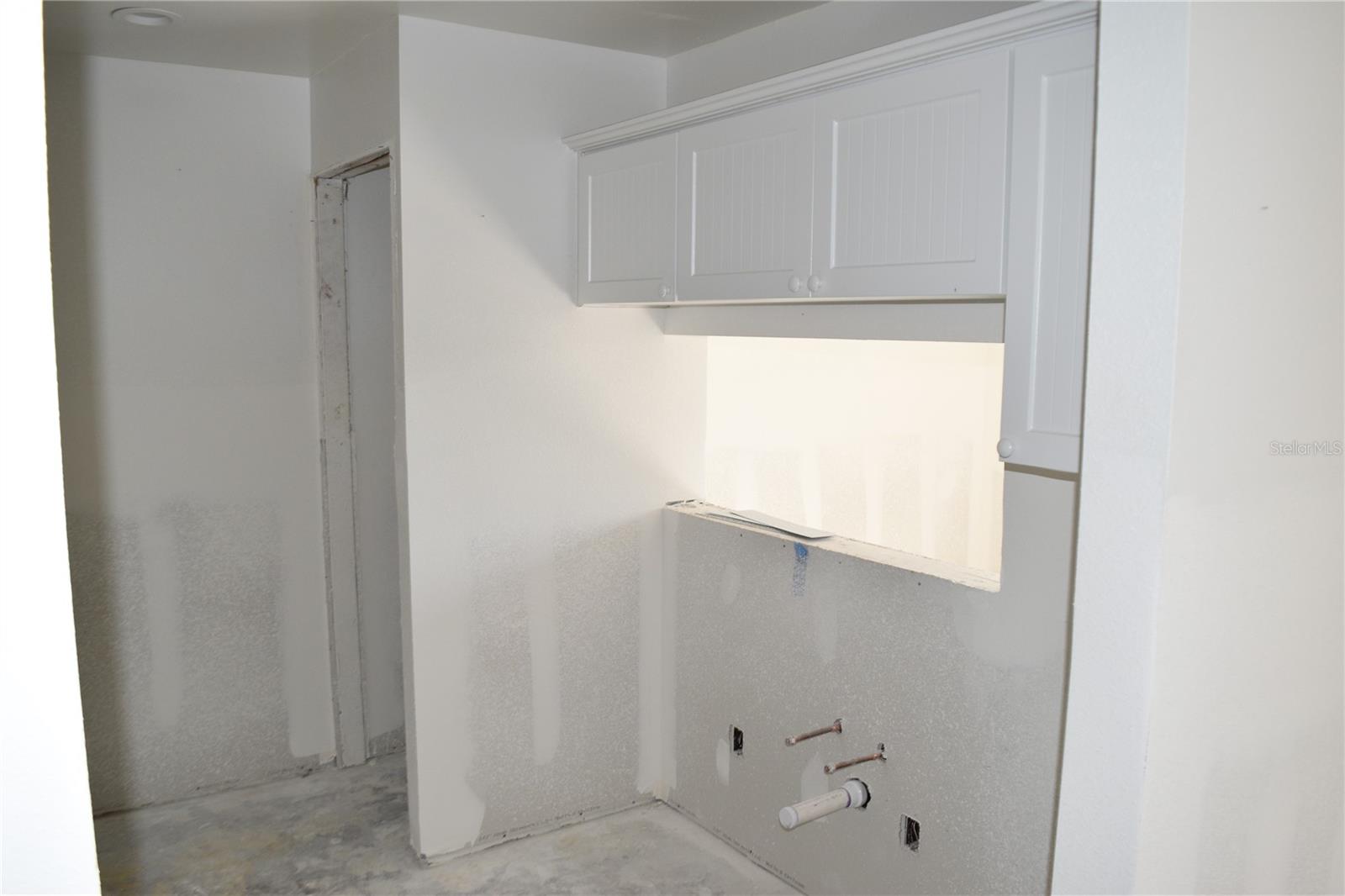 Kitchen sink area with passthrough to dining room