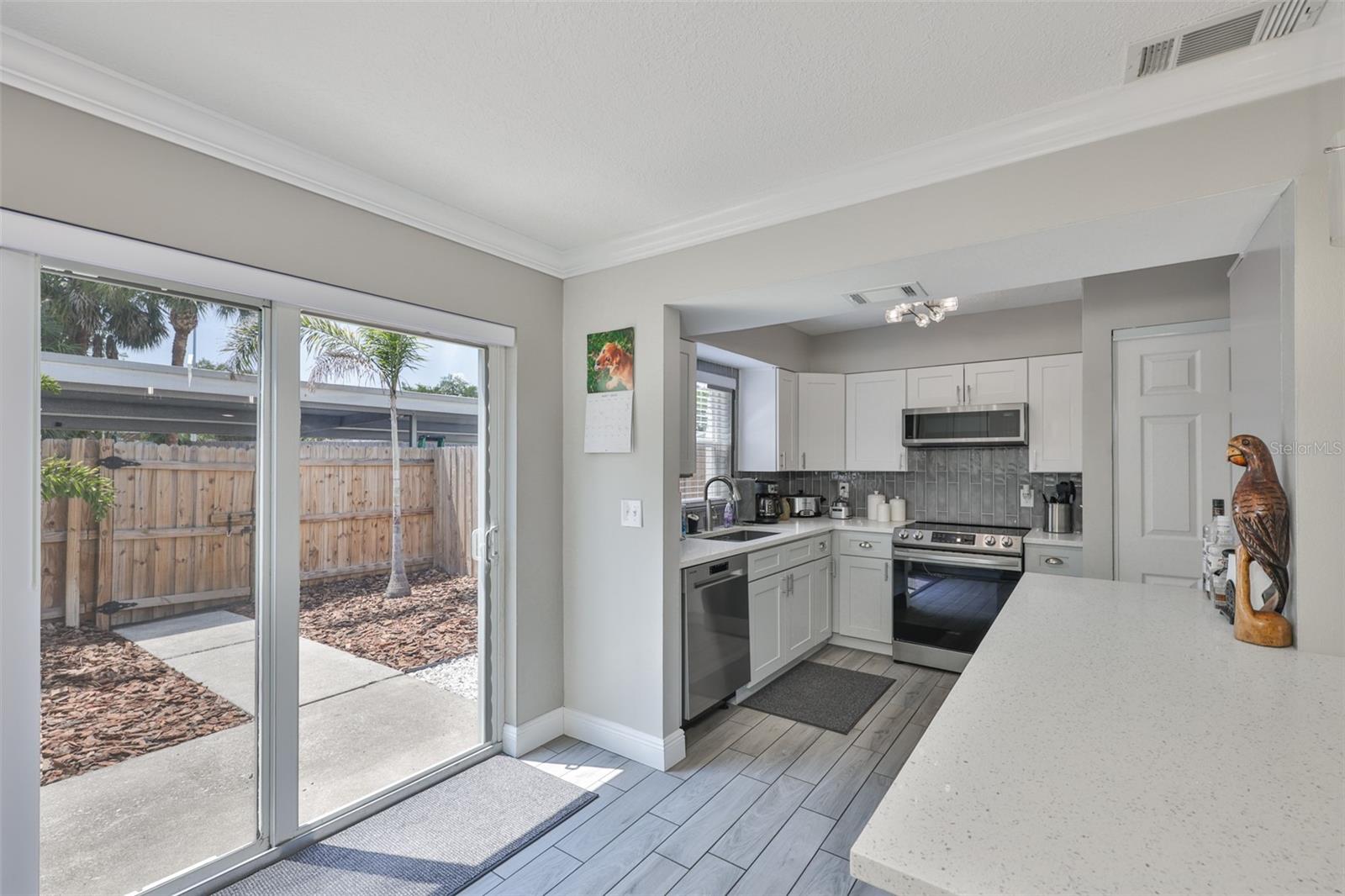 Hurricane Impact Sliding doors leading out to private Patio
