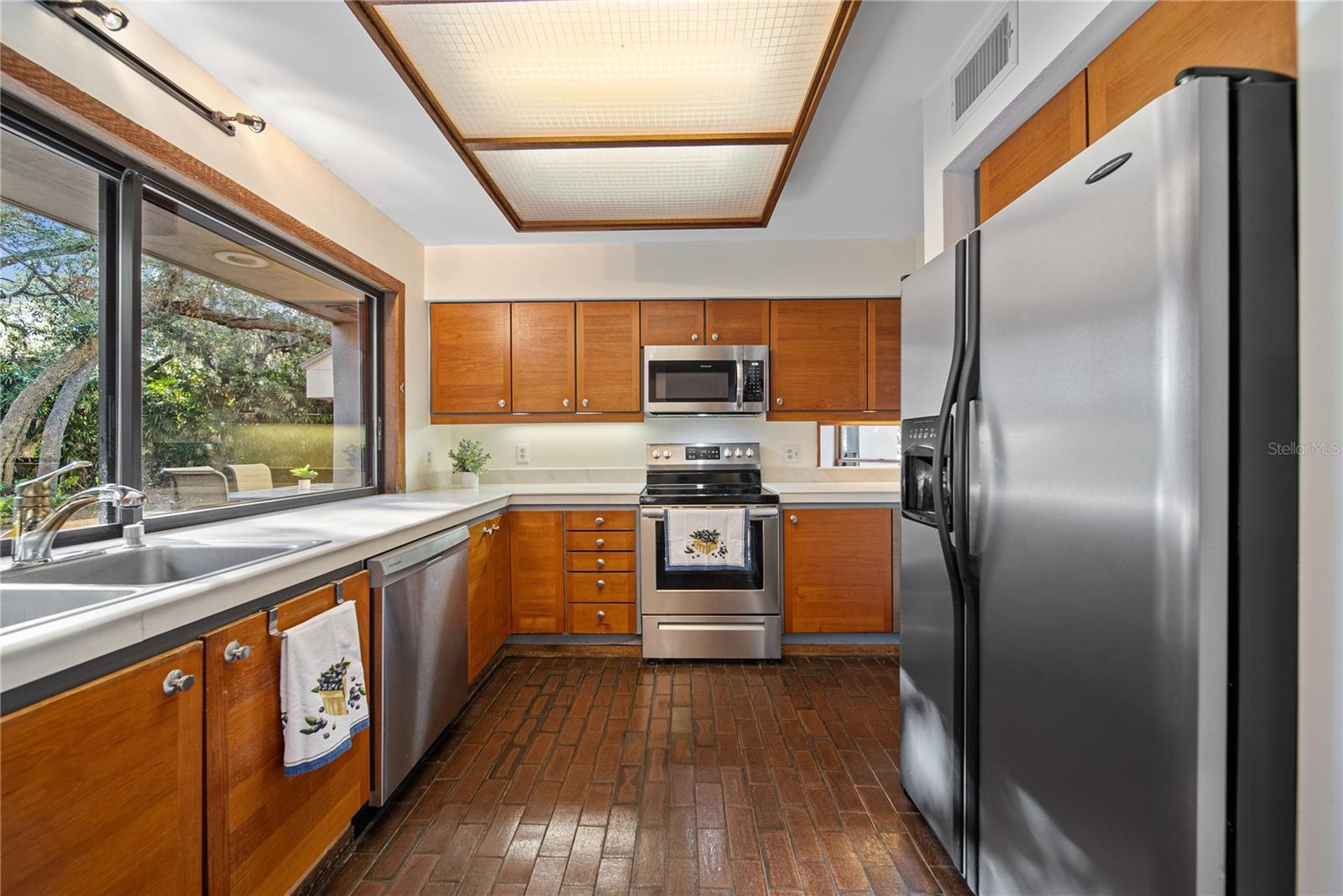 Kitchen featuring Teak wood cabinets.