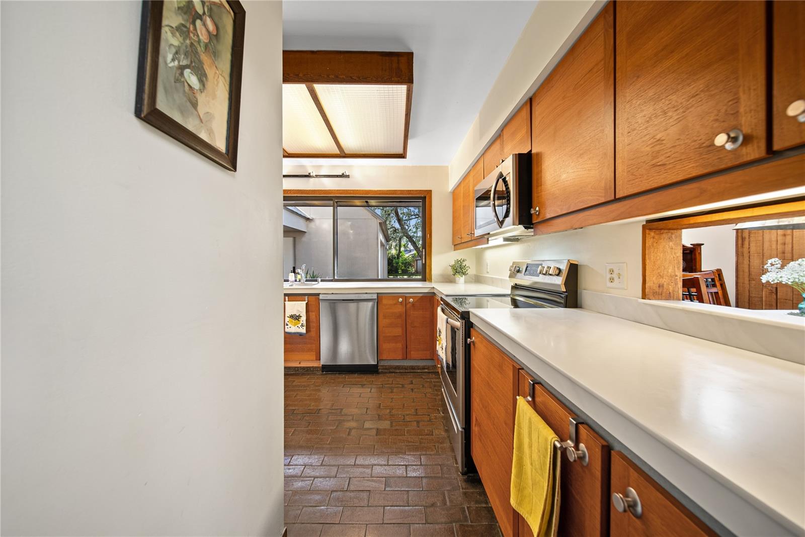 View of kitchen and pass through window to dining room