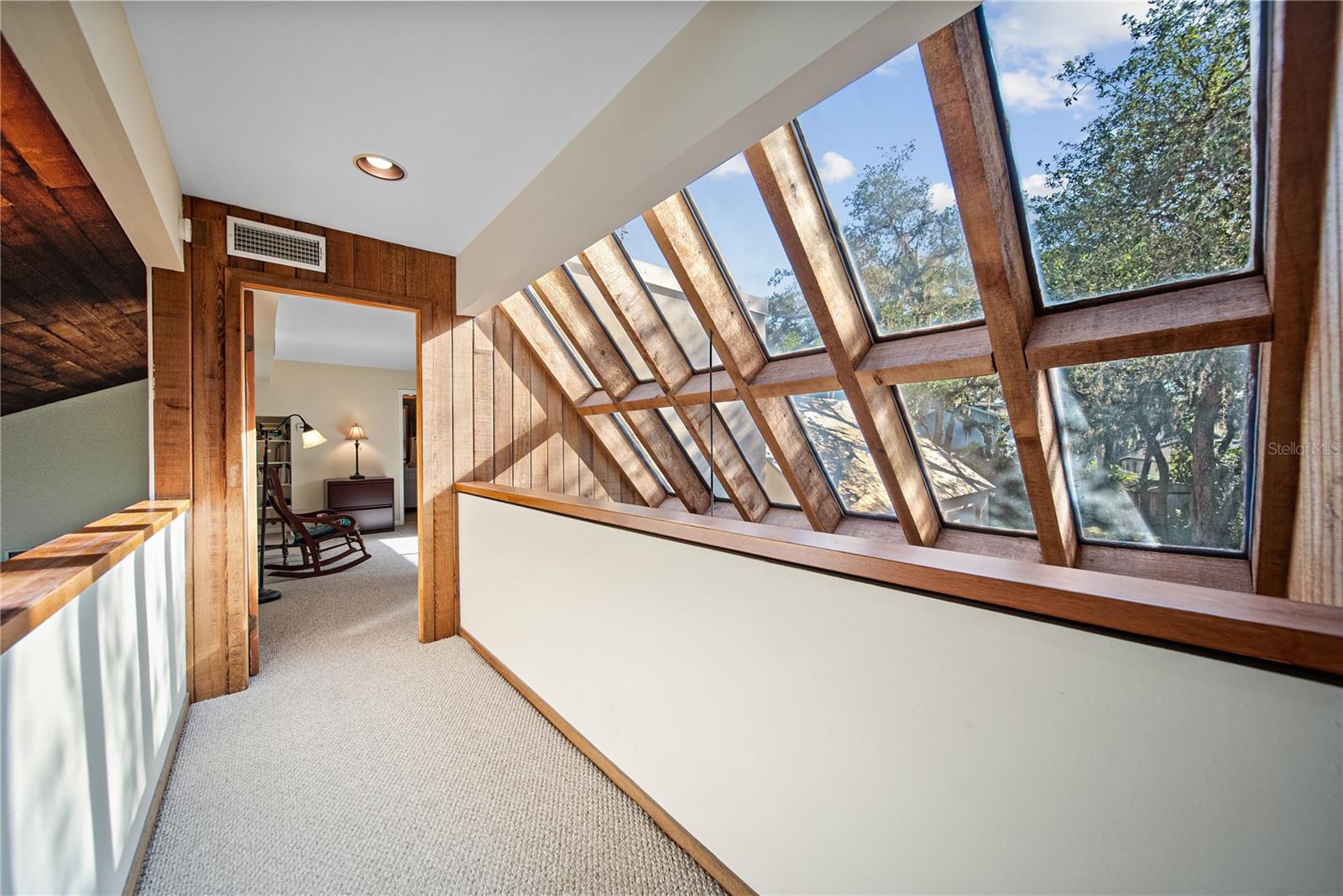 Upstairs the windows keep going and there plenty of light throughout!